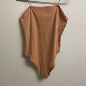 tan body suit